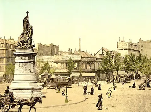 Street scene and monument in the Place Clichy Paris France